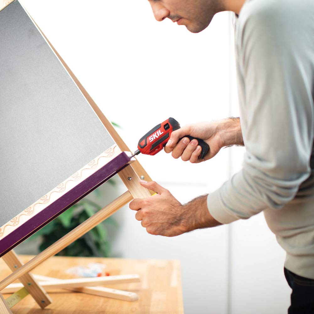 SKIL screwdriver in use assembling cabinet hardware, speeding up household projects