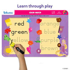 Child tracing letters on a Skillmatics mat with a marker, building handwriting skills