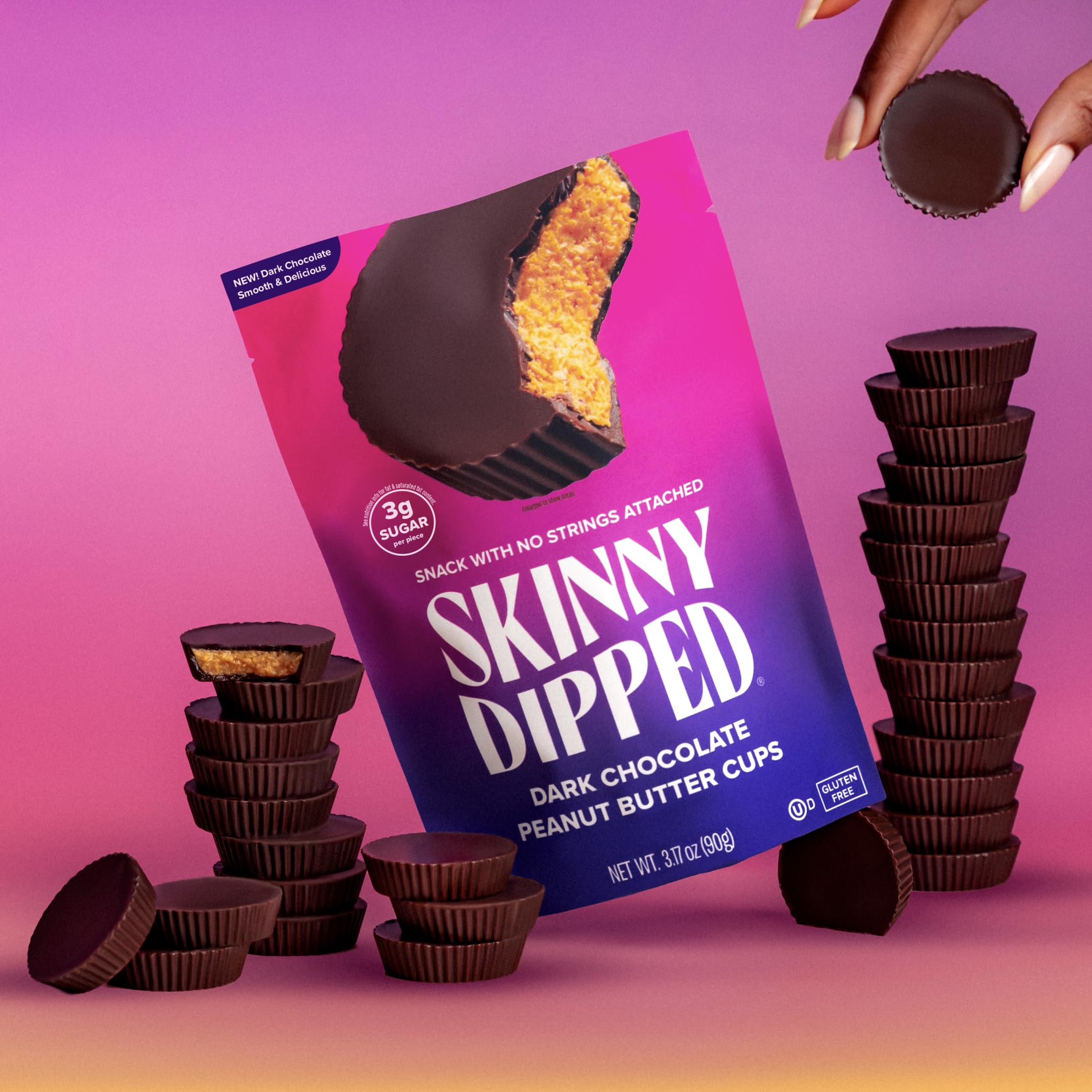 SKINNYDIPPED cup held in hand to demonstrate true-to-scale portion size for snacking control