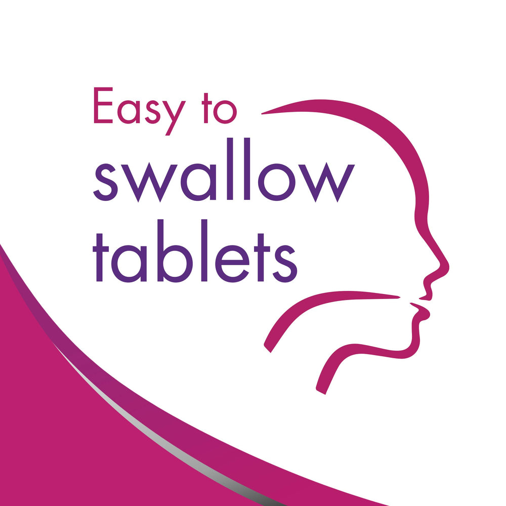 Slow Fe tablet in hand to show scale and single daily dose convenience