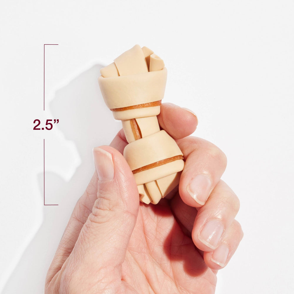 Pile of SmartBones mini chews highlighting bone shape and texture