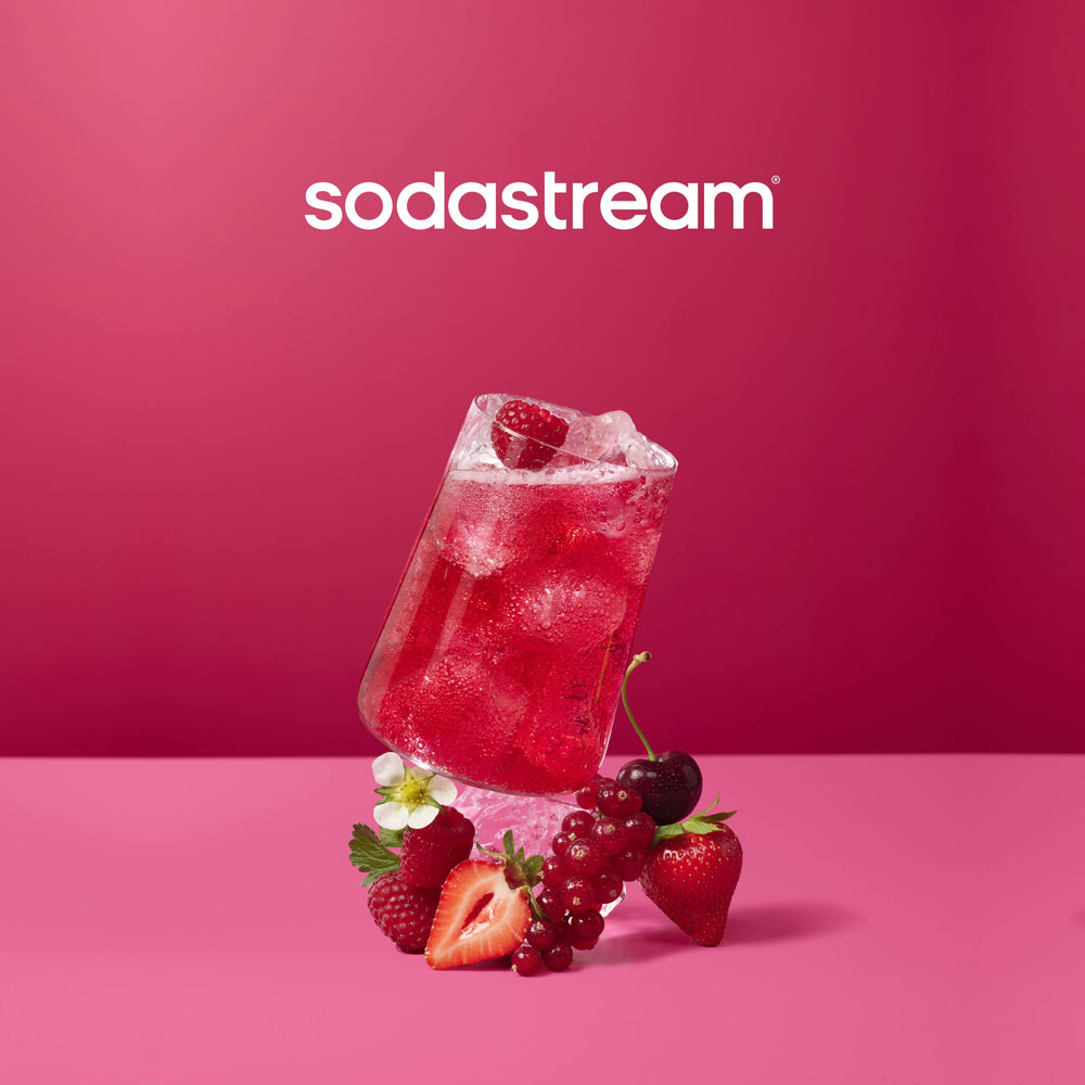 SodaStream pouring syrup into glass, demonstrating easy home preparation benefit
