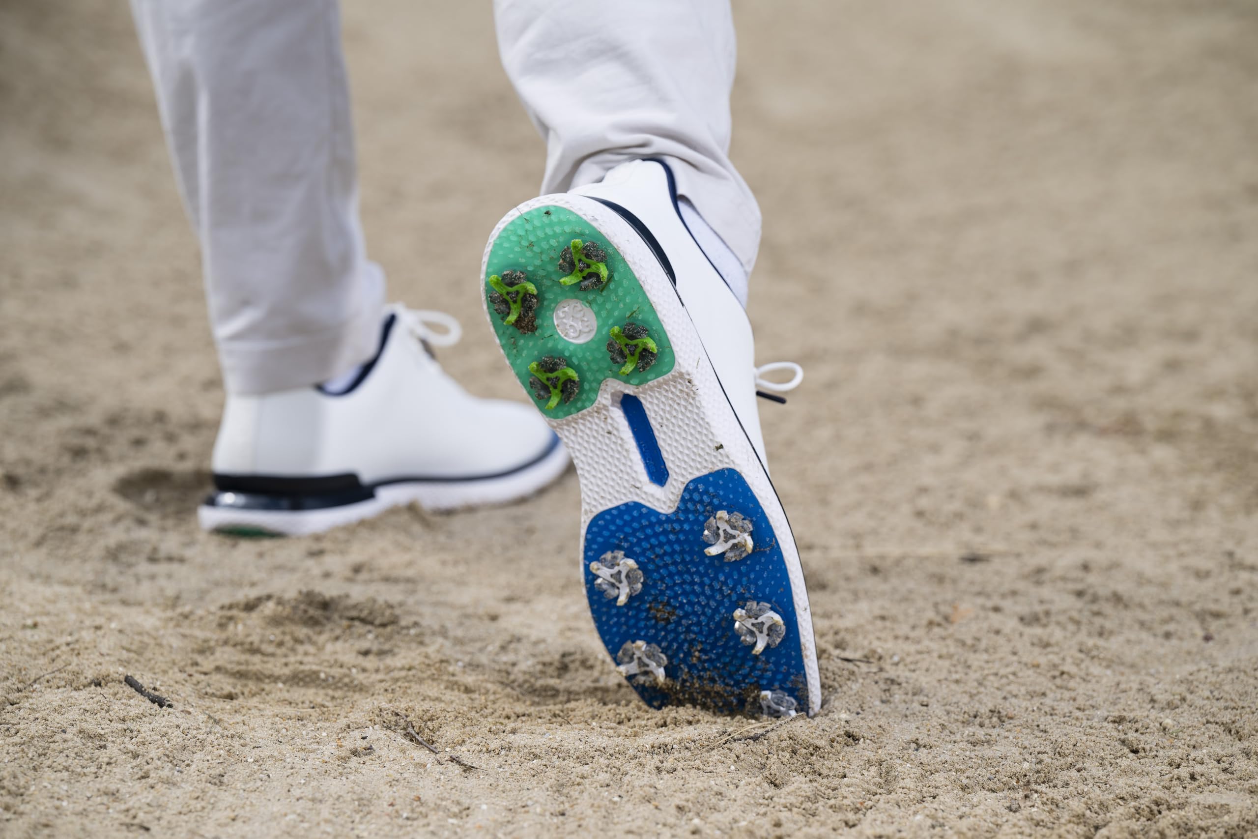 SOFTSPIKES footprint on grass showing green-friendly dispersed contact