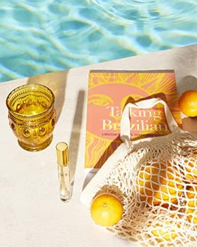 Sol de Janeiro bottle held in hand showing 8mL scale and convenient portability