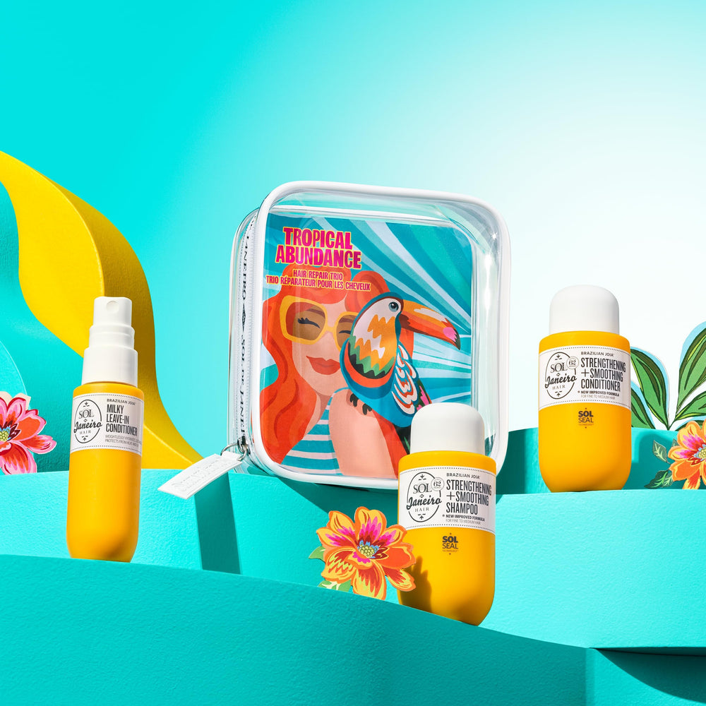 Sol de Janeiro travel bottles next to passport showing portable size convenience