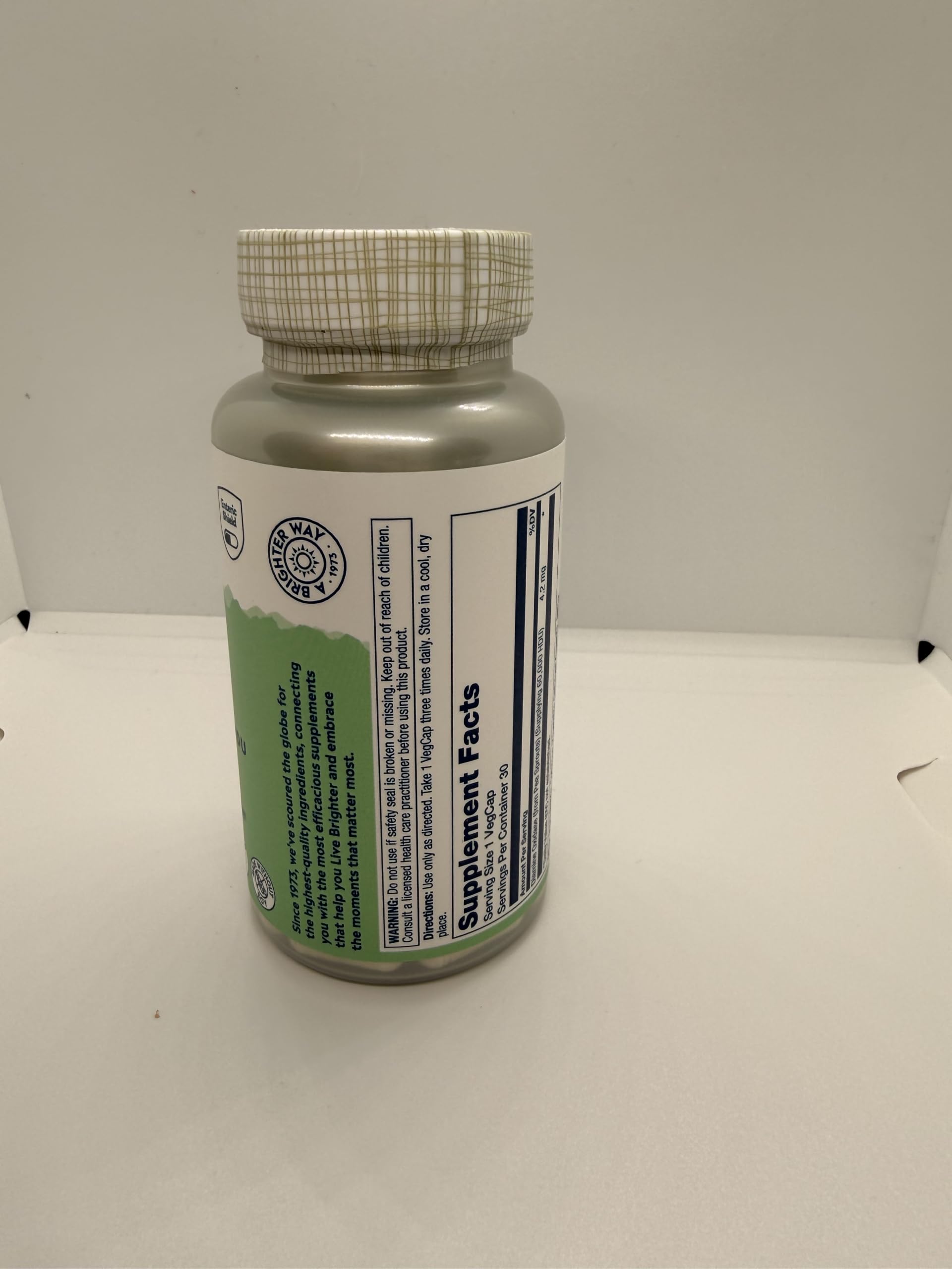 SOLARAY capsule near meal on table demonstrating meal-time use benefit