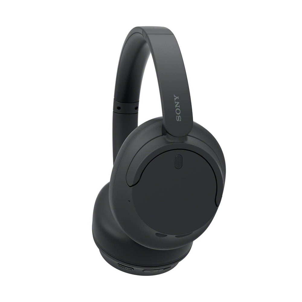 Sony WH-CH720N worn at desk showing comfortable fit for focused work sessions