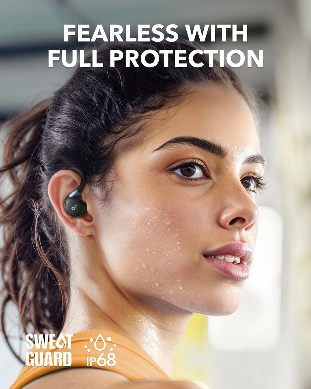 Soundcore Sport X20 next to a phone and keys for size comparison and easy everyday carry