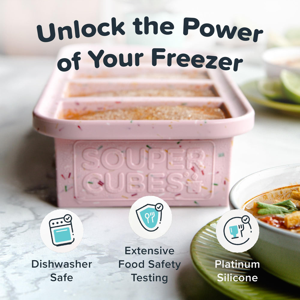 Souper Cubes next to a measuring cup to show one-cup size and portion control