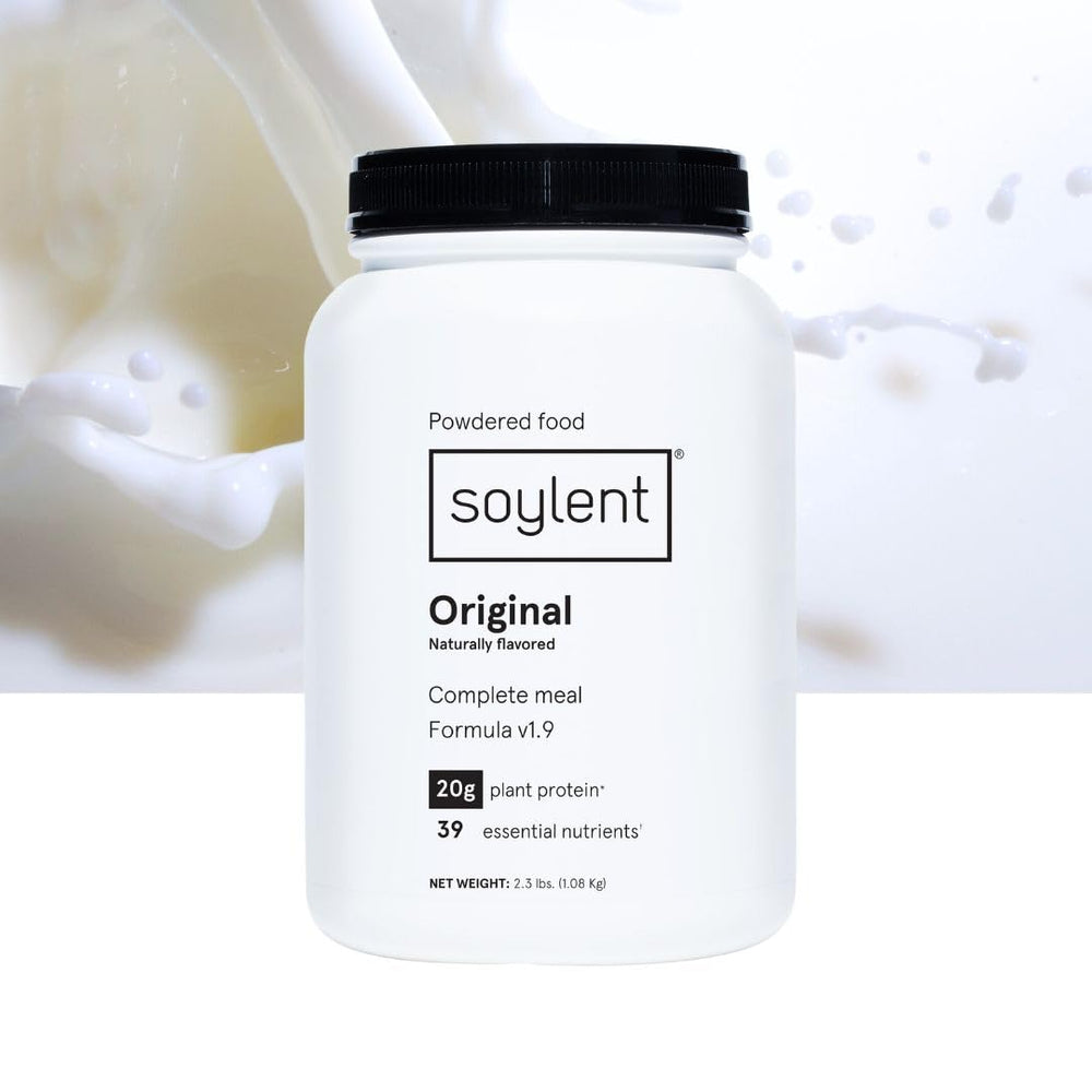 Soylent at a desk breakfast setup, showing quick nutritious meal option
