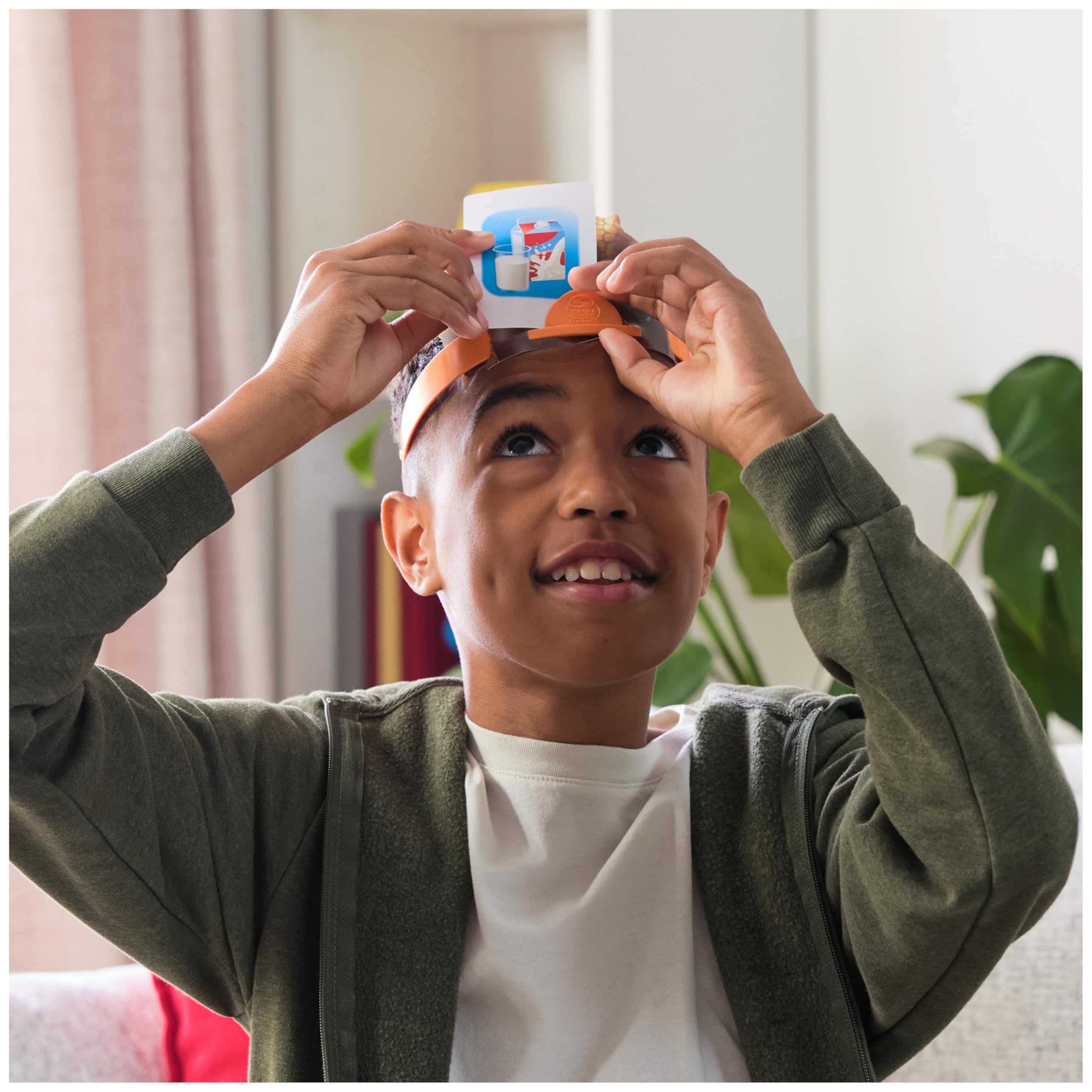 Spin Master Hedbanz family playing in living room promoting inclusive group fun