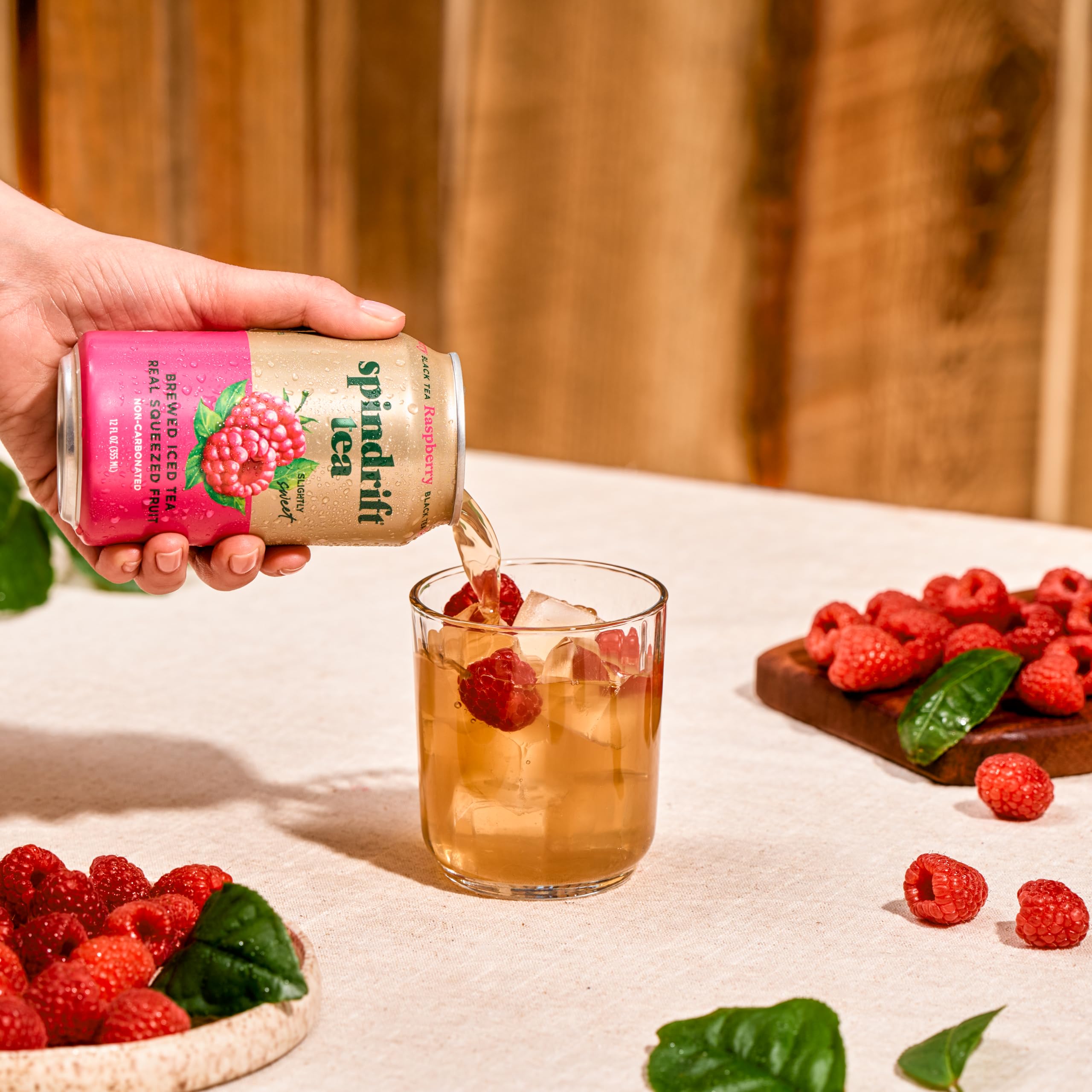 Hand holding Spindrift can to show scale, portable low-calorie beverage option