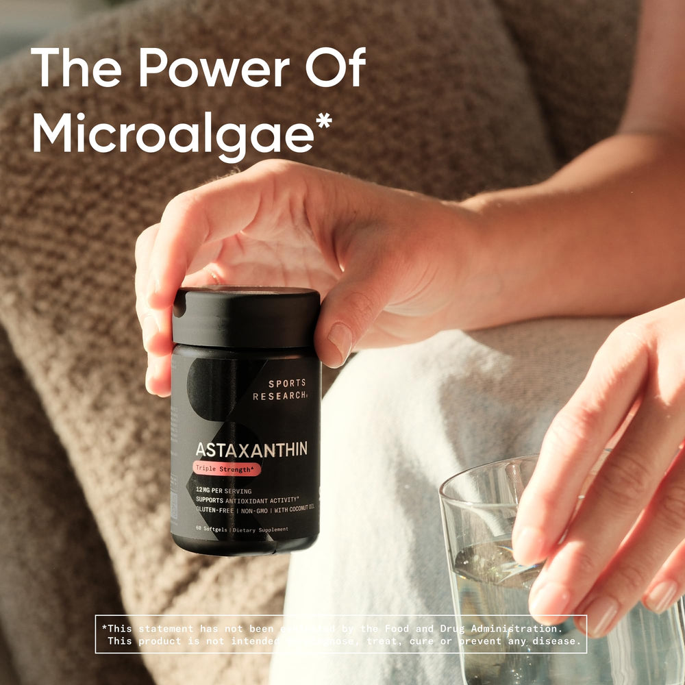 Sports Research capsule sliced with coconut oil droplet illustrating improved absorption