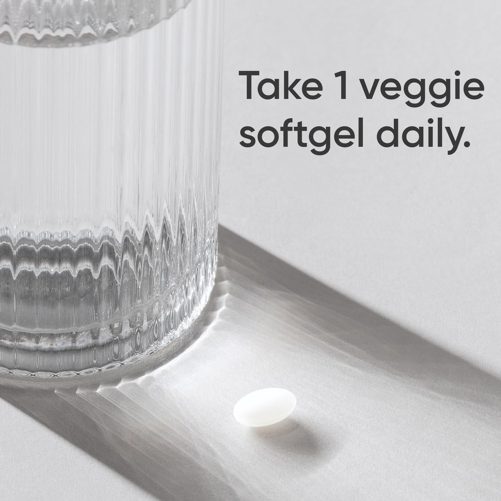 open bottle with capsules poured out illustrating easy once-daily dosing