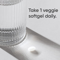 open bottle with capsules poured out illustrating easy once-daily dosing