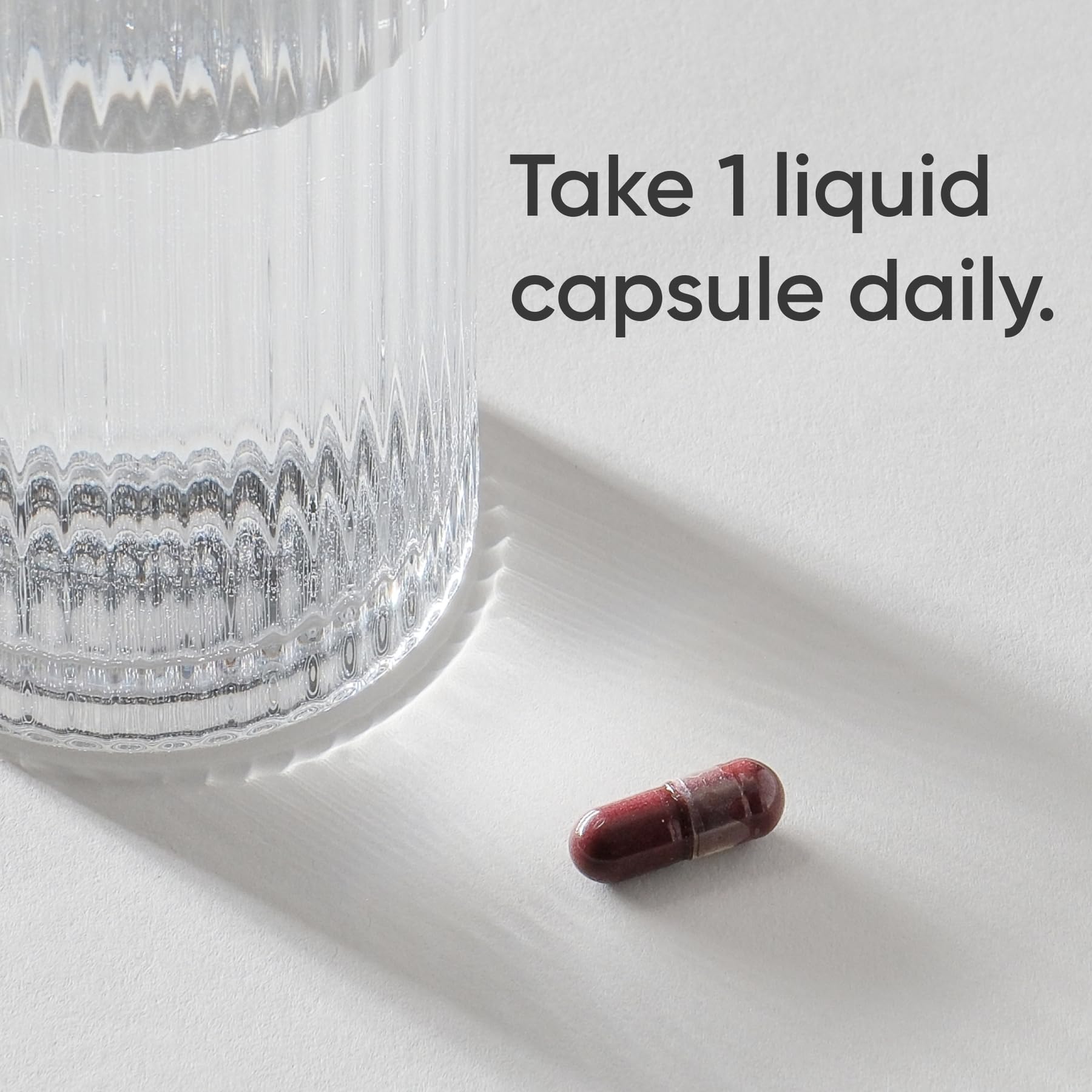 Sports Research capsule next to coin to show size and convenient daily dose