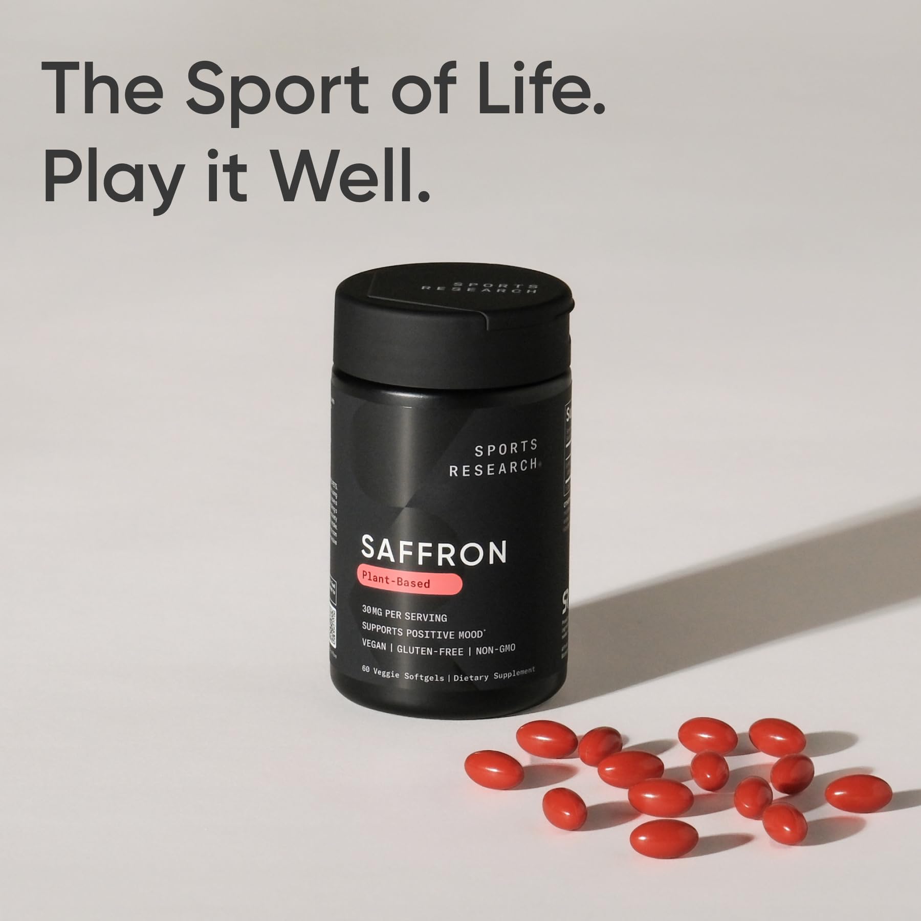 Sports Research saffron stigmas beside capsule showing natural ingredient sourcing benefit