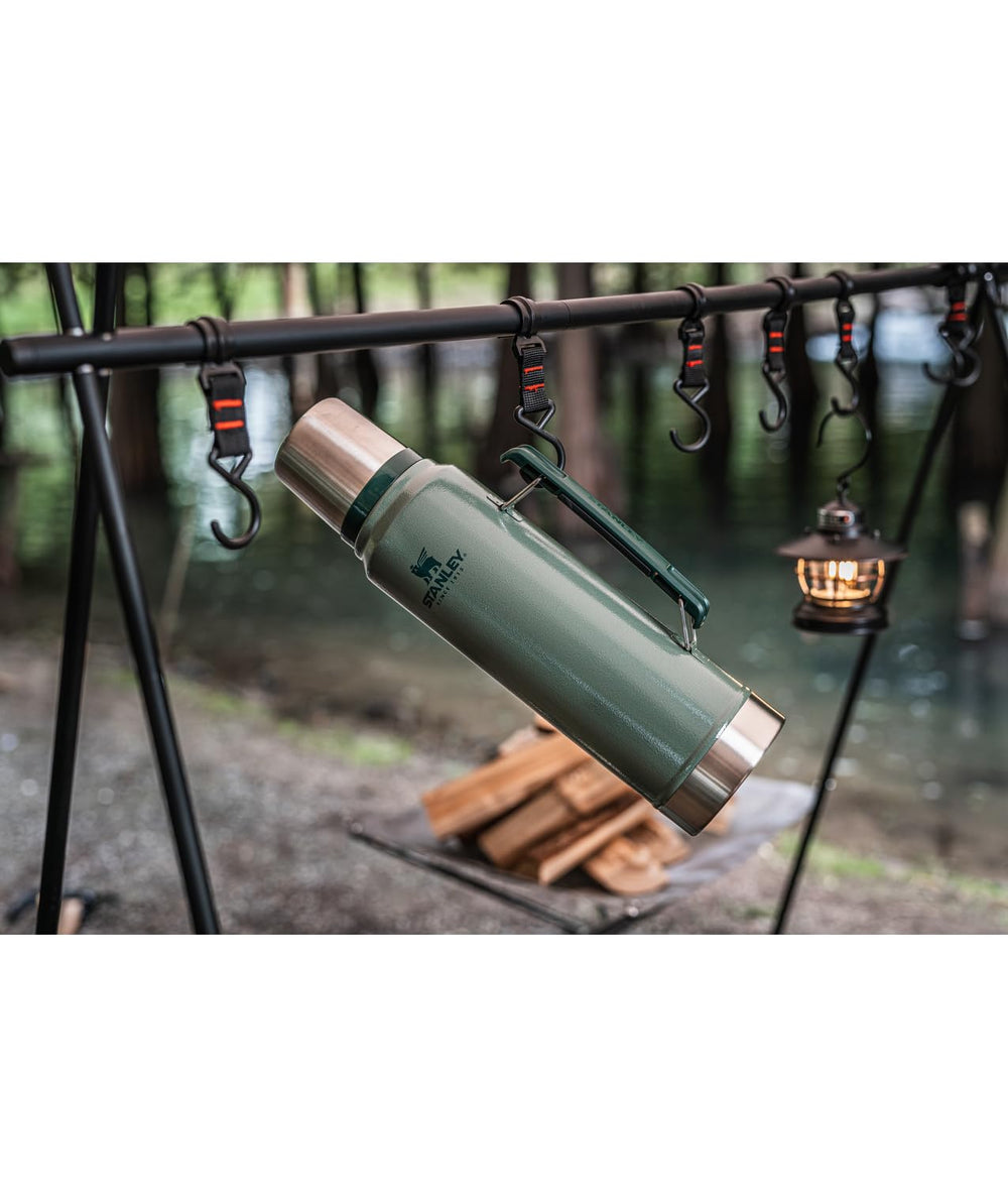 STANLEY bottle packed inside backpack on trail, demonstrating leakproof travel convenience