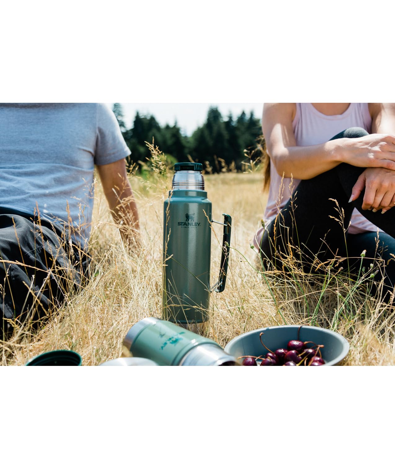 STANLEY bottle held in hand for scale, illustrating packable size and portability