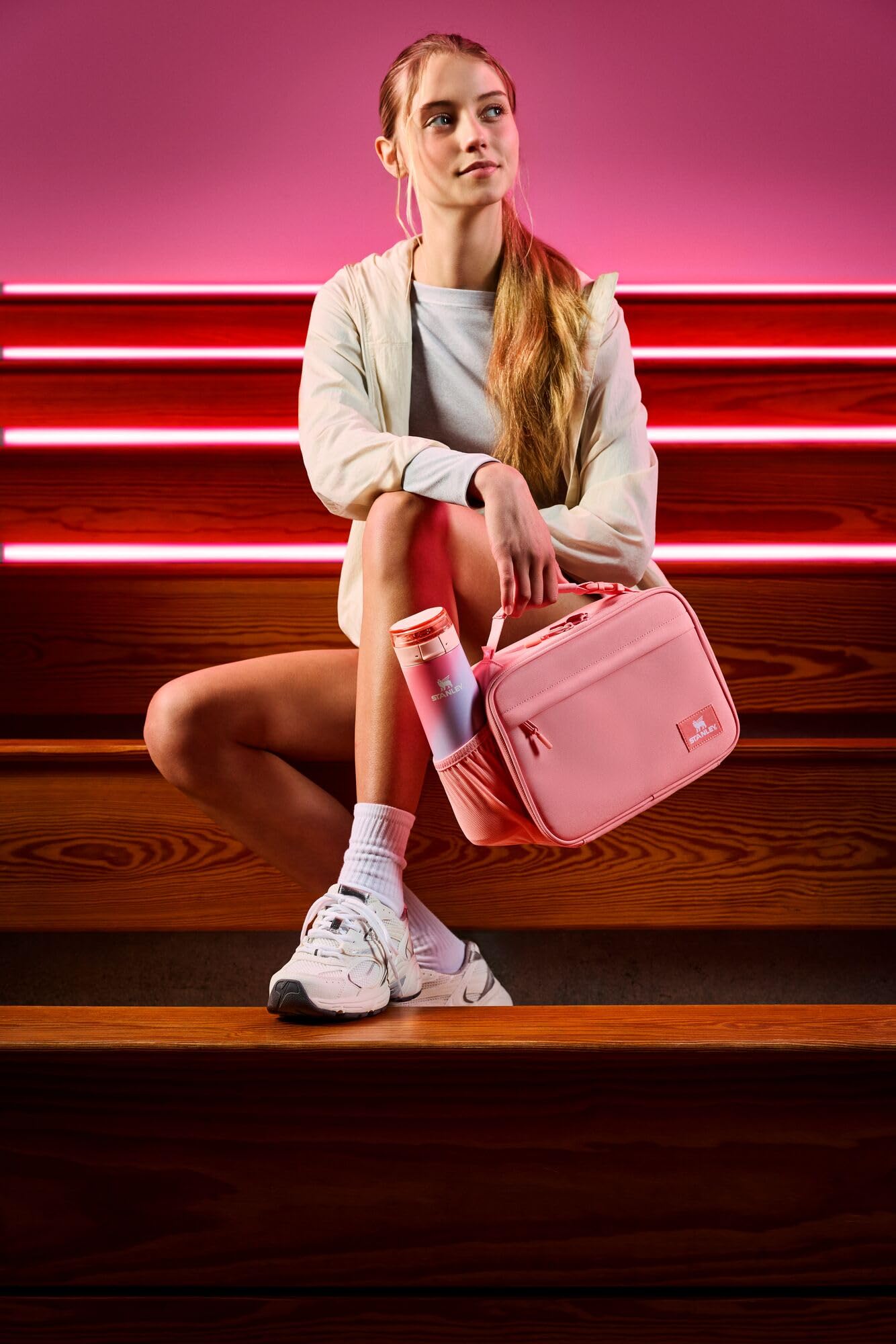 Buckle handle clipped to STANLEY Assembly Backpack illustrating hands-free transport