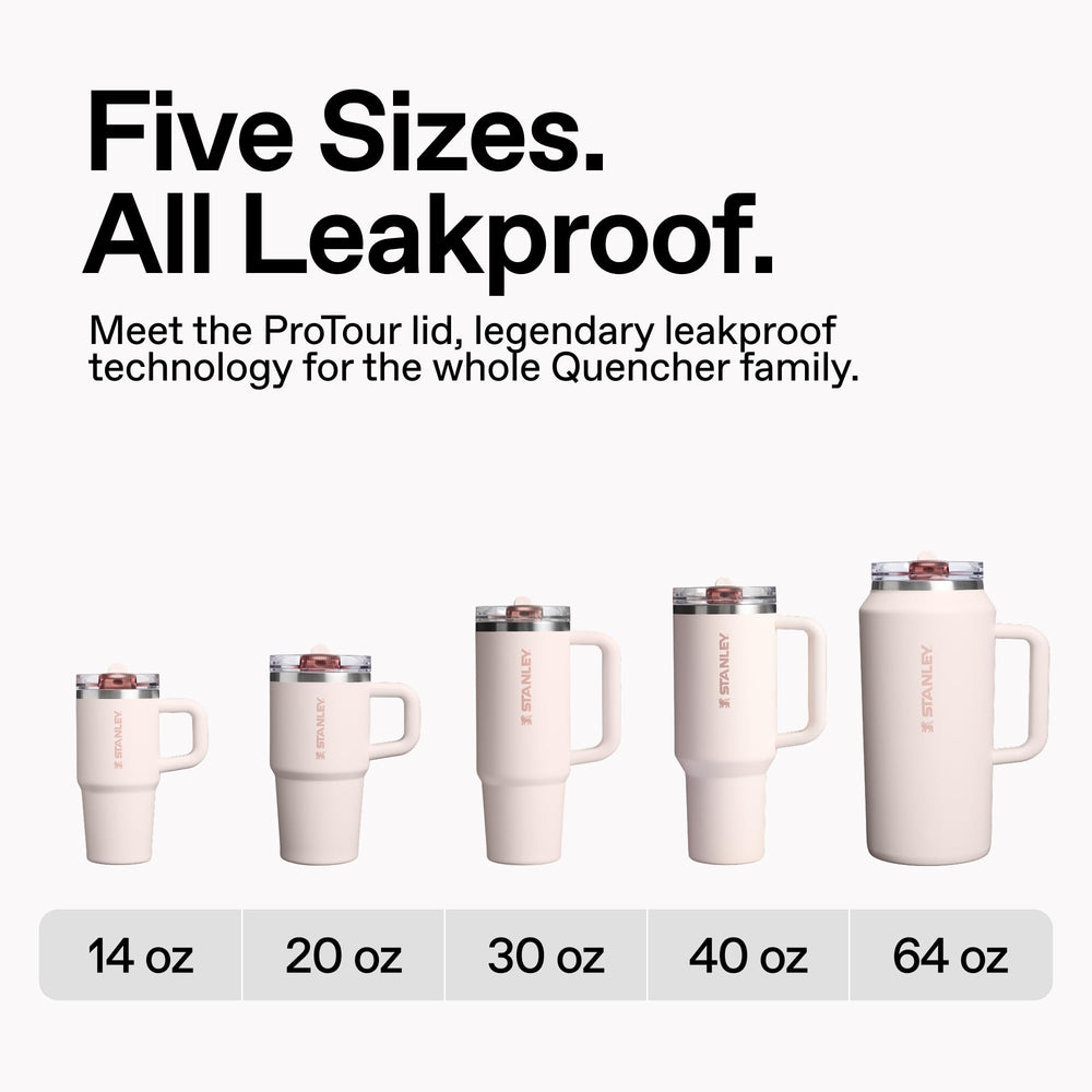 STANLEY Quencher next to water bottle for 40 oz size and portability comparison