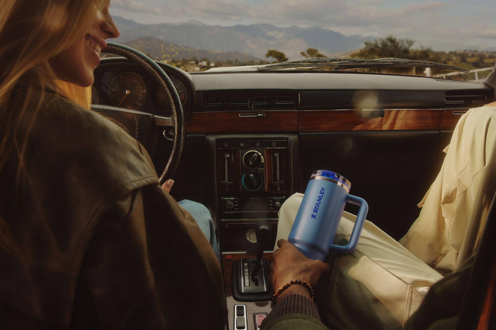 STANLEY Quencher on a trail side table demonstrating cold drinks on outdoor adventures