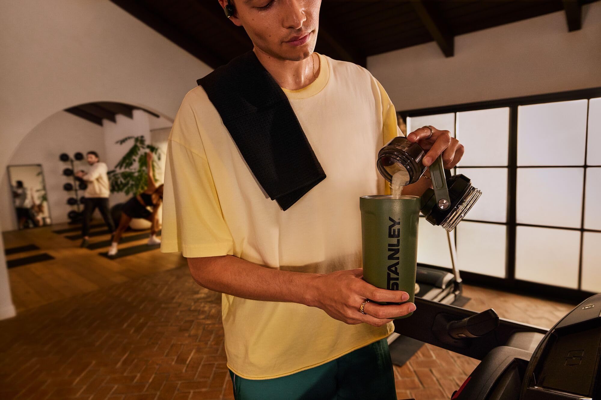 STANLEY Vitalize held in hand showing compact 20 oz size for easy portability