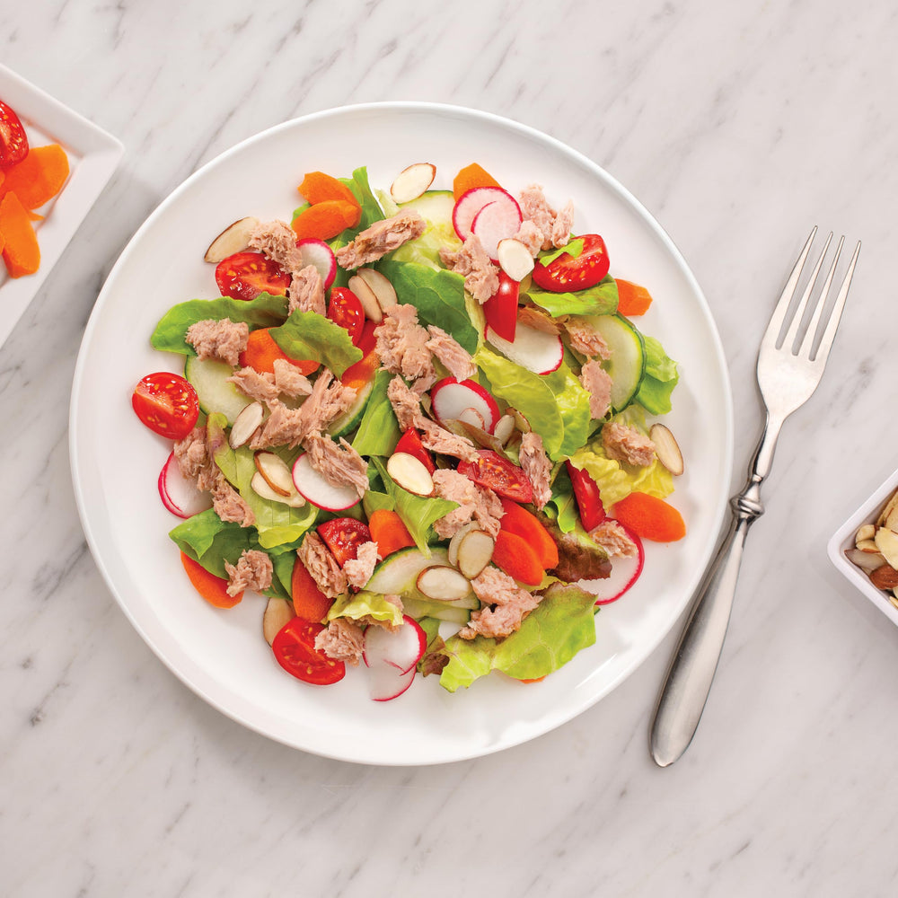 StarKist pouch atop salad bowl adding protein and easy prep