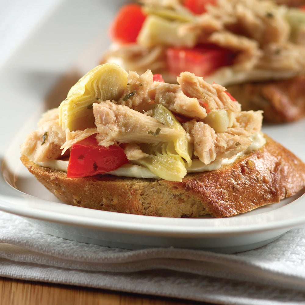 StarKist pouch being added to sandwich for a fast nutritious lunch