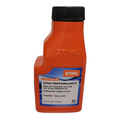 STIHL pouring 2.6-ounce bottle into gas can for mess-free field mixing