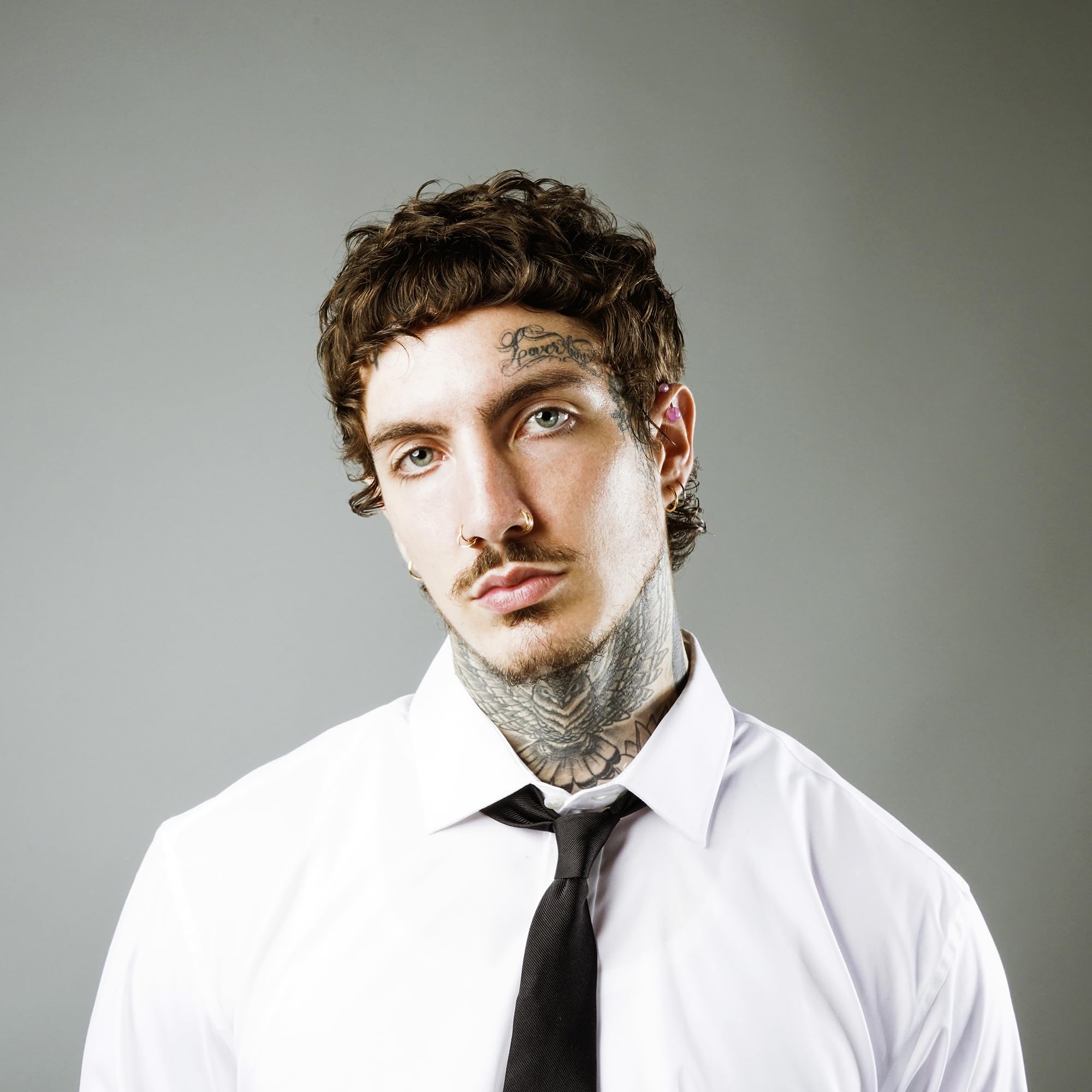 STMNT curl cream on curly beard close-up highlighting softened beard texture and control