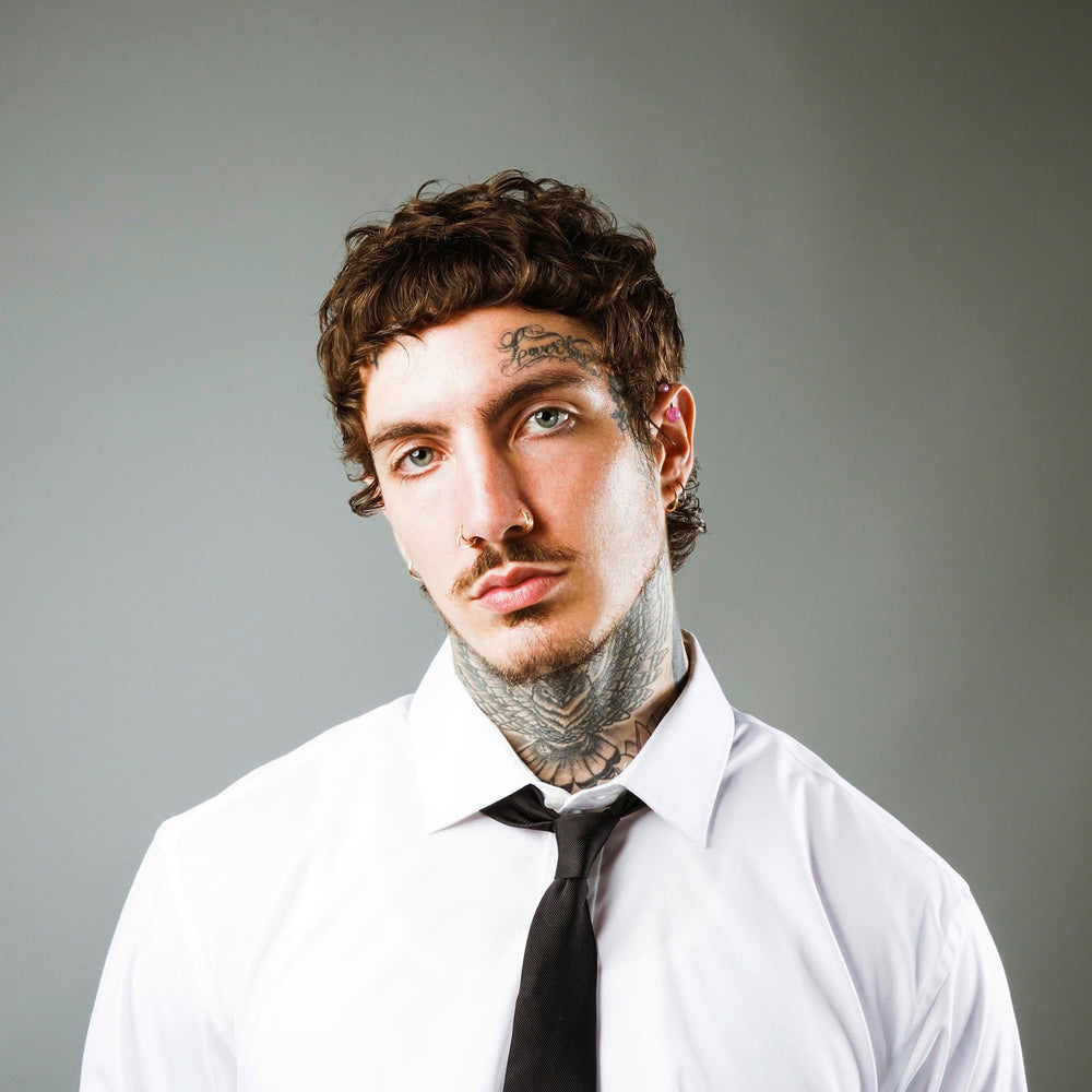 STMNT curl cream on curly beard close-up highlighting softened beard texture and control