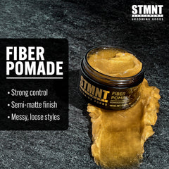 STMNT pomade on hand being warmed for smoother application and control