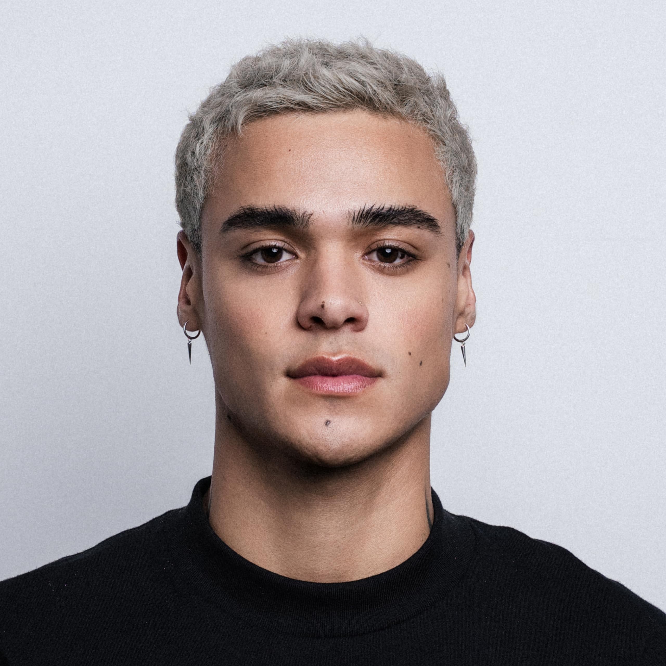 STMNT applied to hair showing textured, semi‑matte styling result
