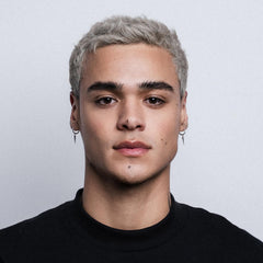 STMNT applied to hair showing textured, semi‑matte styling result