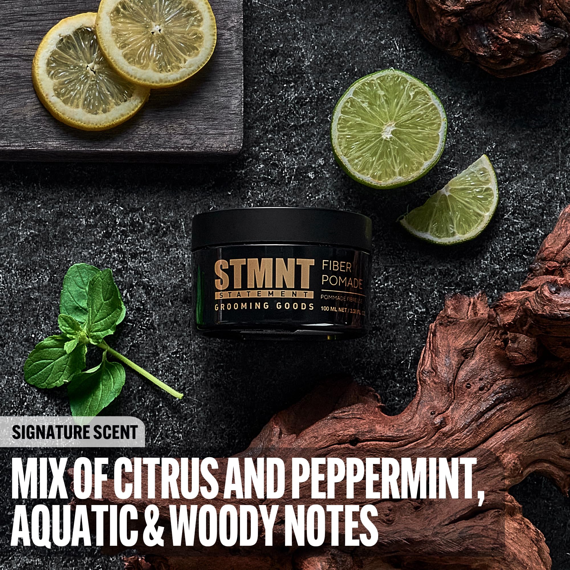 STMNT open jar close‑up displaying pomade texture and elastic fibers
