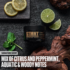 STMNT open jar close‑up displaying pomade texture and elastic fibers
