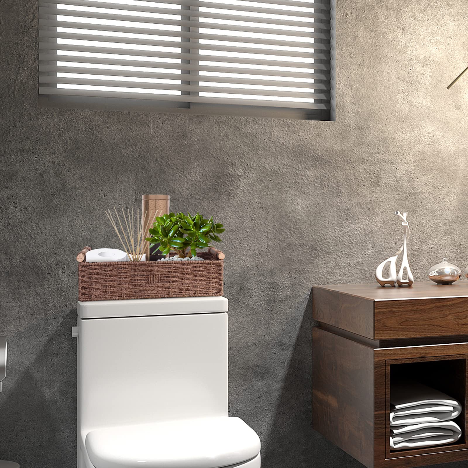 STOBSK holding toilet paper and toiletries to show convenience