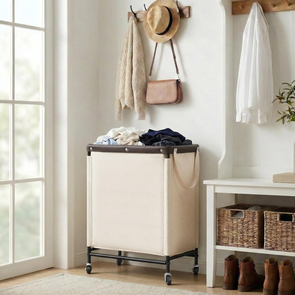 StorageWorks size comparison with laundry items showing generous 100L capacity