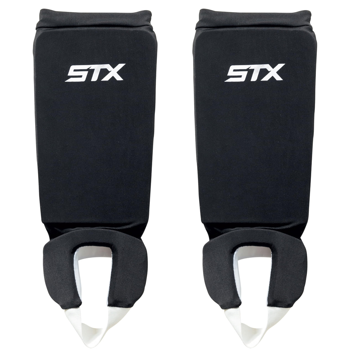 STX reversible shin shield front view showing black and white sides for quick team color change and dependable protection