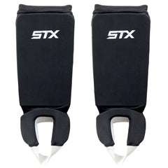 STX reversible shin shield front view showing black and white sides for quick team color change and dependable protection