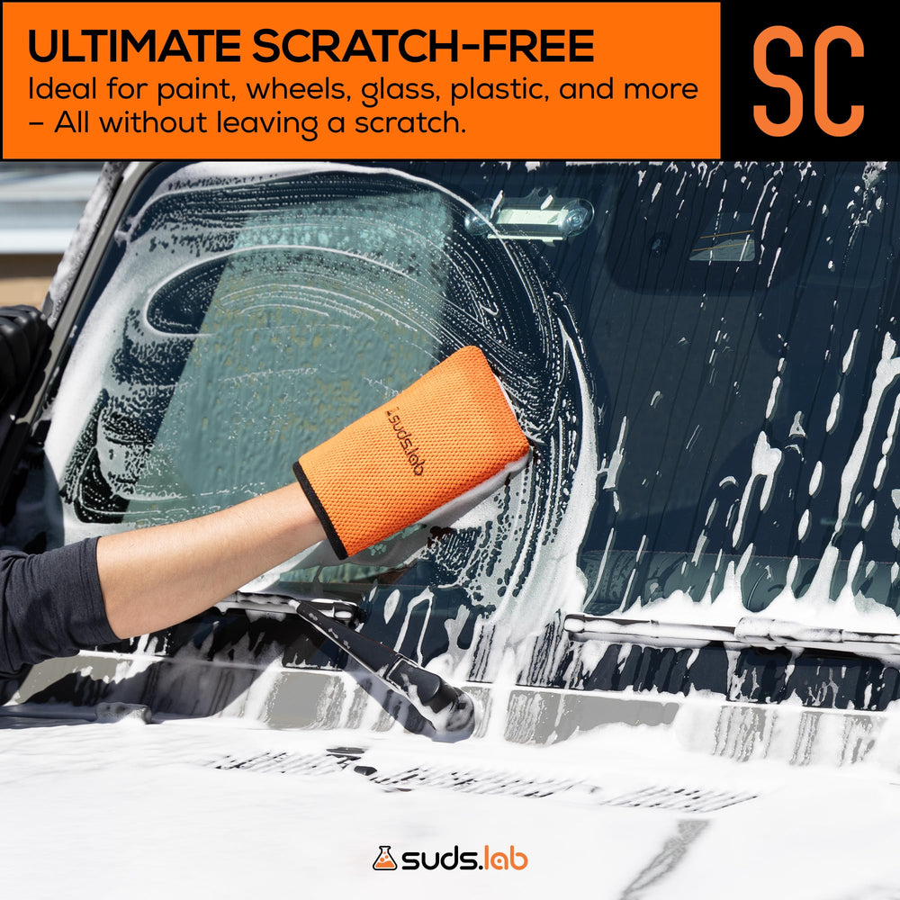 suds.lab mitt held in hand to show scale and ergonomic fit advantage