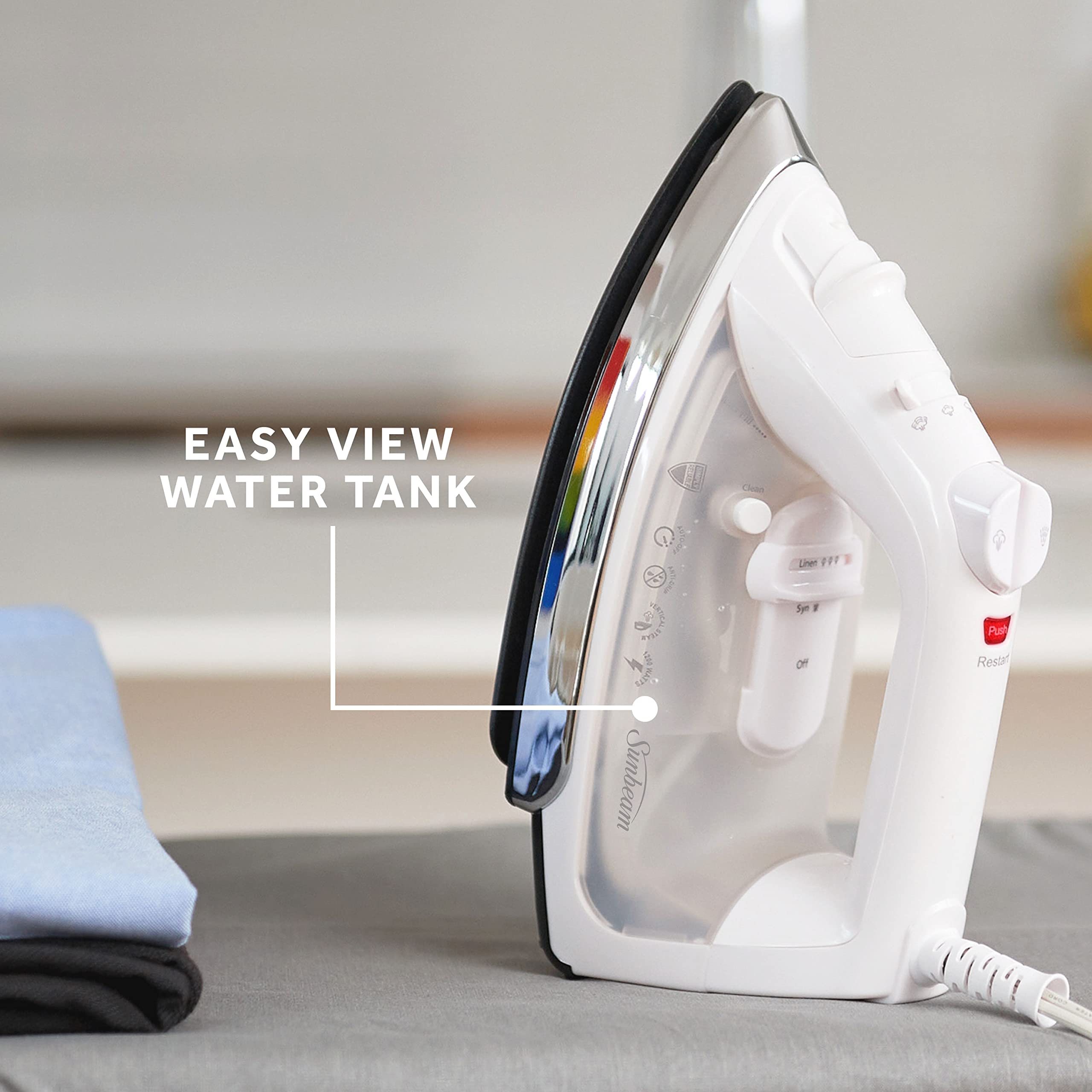 Sunbeam spray mist feature demonstrated to loosen tough wrinkles before ironing