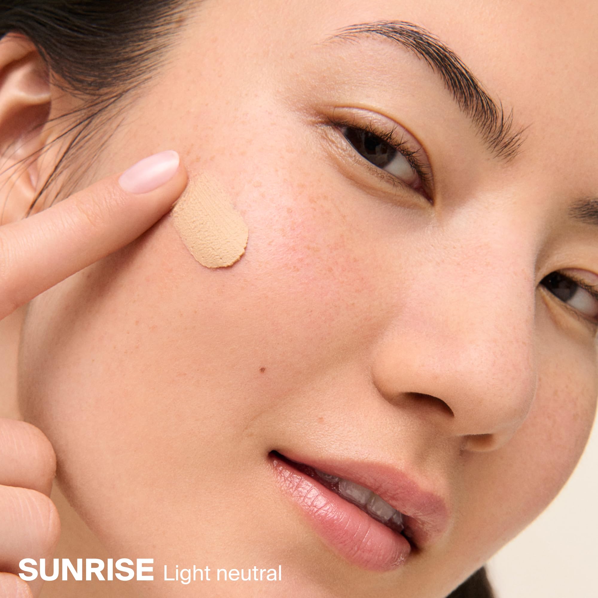 Supergoop! applying Mattescreen on hand to show easy blend and pore-blurring effect