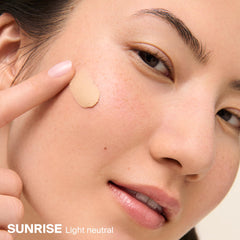 Supergoop! applying Mattescreen on hand to show easy blend and pore-blurring effect