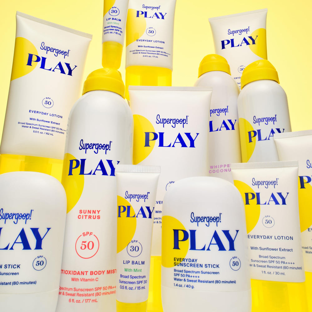 Supergoop! sprayed on wet skin after swim showing reapplication on damp skin