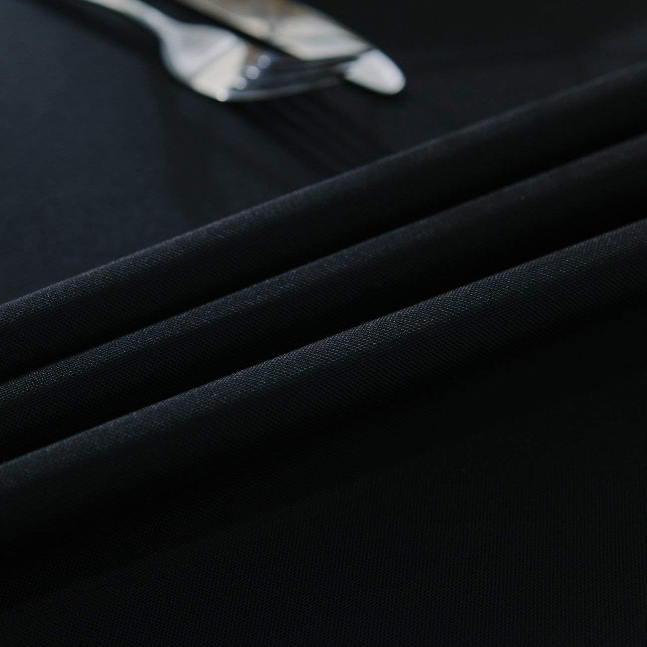 Surmente draped on 6ft table with place settings demonstrating elegant fit