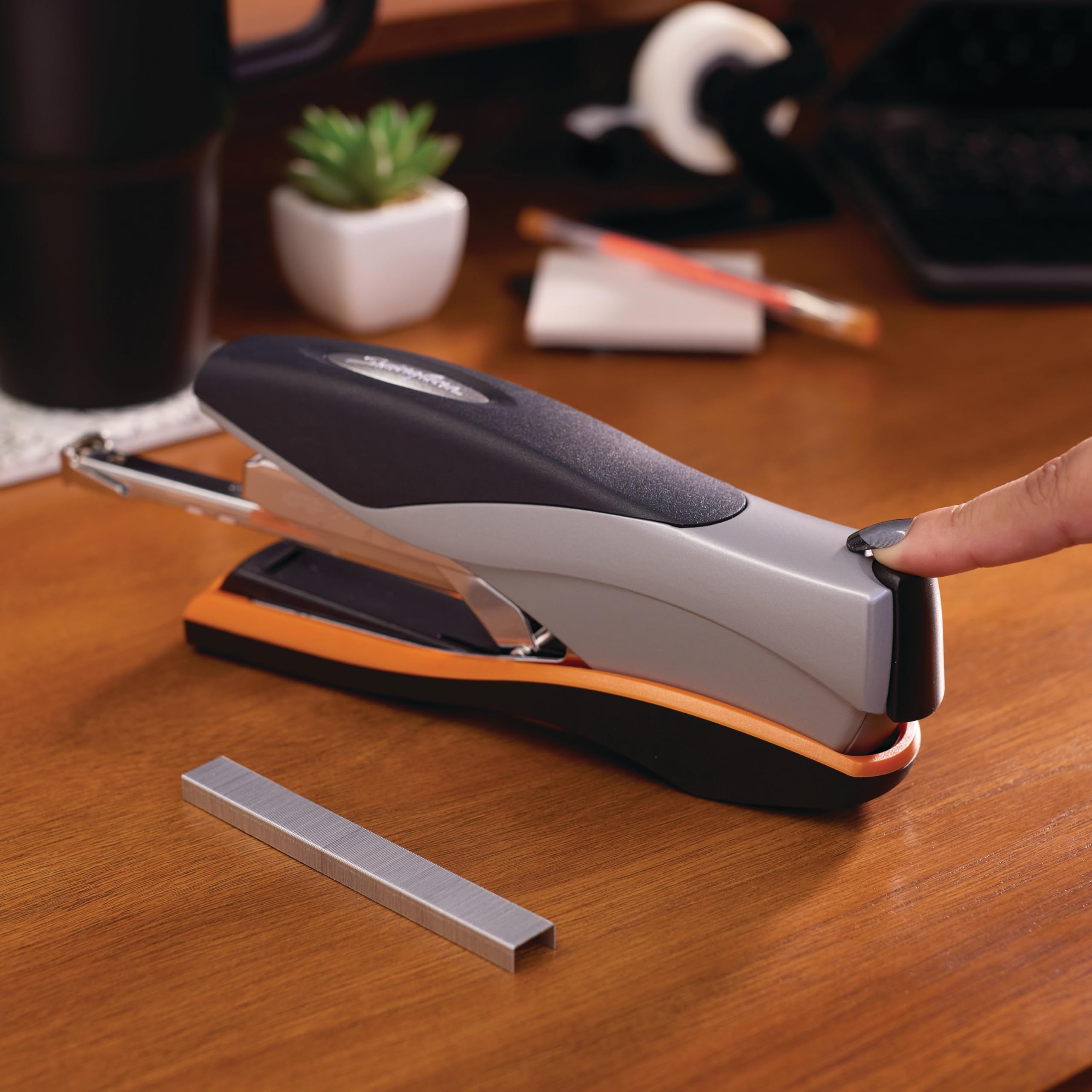 Swingline Optima 40 stapling action in use on thick stack benefit: secures up to 40 sheets