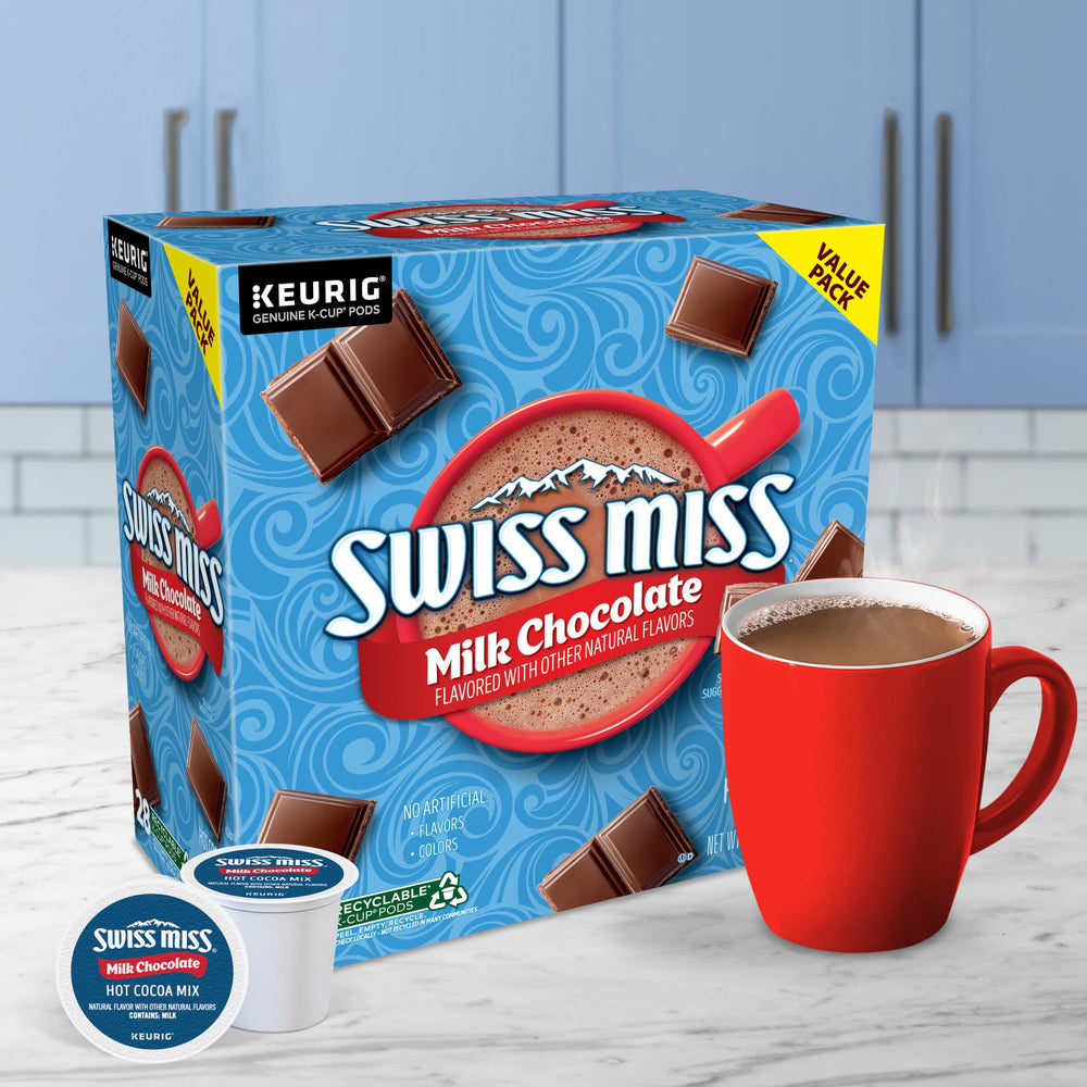 Coworker enjoying Swiss Miss cocoa at office station for quick midday comfort