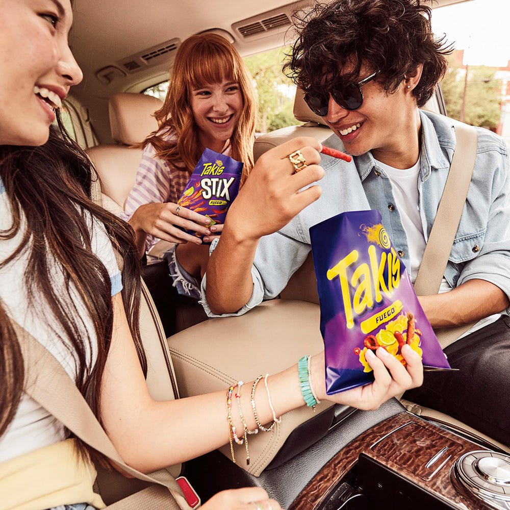 Takis served in a bowl at a party showing convenience and shareability